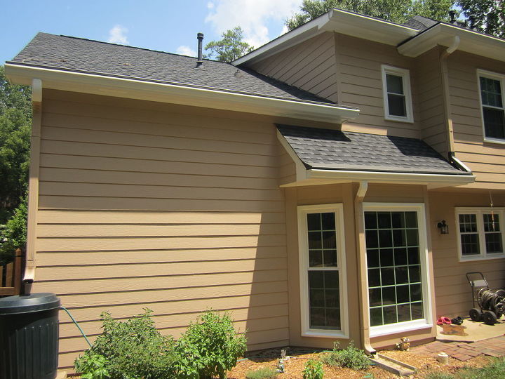 gutter downspouts contrast or blend, Pick a place on the downspout elbow to match the sight line of the siding