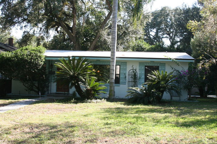 q a project we just finished in downtown orlando this house has large windows in the, gardening, landscape, Sagos in front of windows