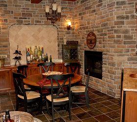 wine grotto meet wine room, fireplaces mantels, home decor, Not only richly detailed with stone surround but accented nicely with fireplace 1 of 5 in the home full wet bar with wine refrigerator and hammered copper sink basin but chandelier and custom mill working