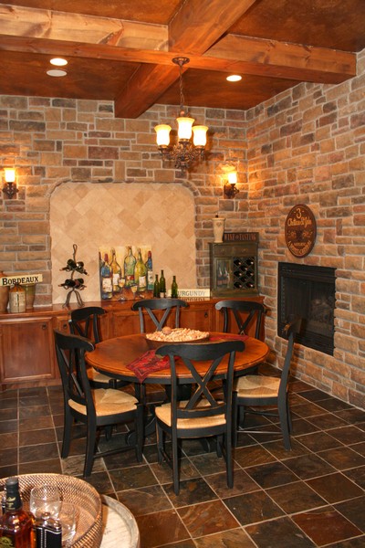 wine grotto meet wine room, fireplaces mantels, home decor, The ceiling is even elaborate with exposed beams and the floor is slate You can easily enjoy this space for wine tastings informal dining and game playing Poker anyone