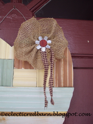 my unordinary valentine recycling scraps of wood trim, crafts, repurposing upcycling, seasonal holiday decor, valentines day ideas, Add a burlap flower with a Christmas bulb top flattened and a vintage bingo piece as the center