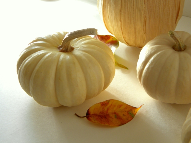 cornhusk covered pumpkin, seasonal holiday decor, Scatter some pretty fall leaves to complete the look
