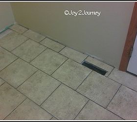 newly tiled mudroom floor and attached bathroom, flooring, laundry rooms, tile flooring, tiling, Cutting tile for around a heat register