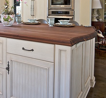 which outlet would you prefer in a kitchen island, Outlet strip look carefully lucky here it matches the finish of the cabinets and is hiding over a conservative overhang