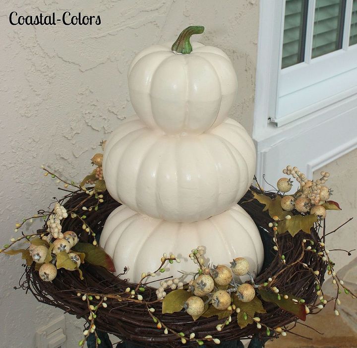 simple fall front porch, porches, seasonal holiday decor, Orange pumpkin toparies were sprayed white because they had faded from previous years of use Floral sprigs were added the the wreaths