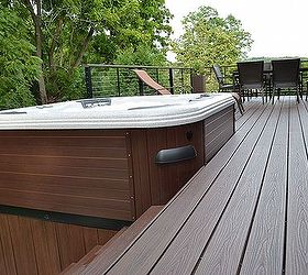 choosing the right deck railing can make all the difference, decks, patio, pool designs, spas, Trex Transcend Decking The Bullfrog Spa s base framed in PVC boards harmonizes beautifully with the project s vintage lantern Trex Transcend decking