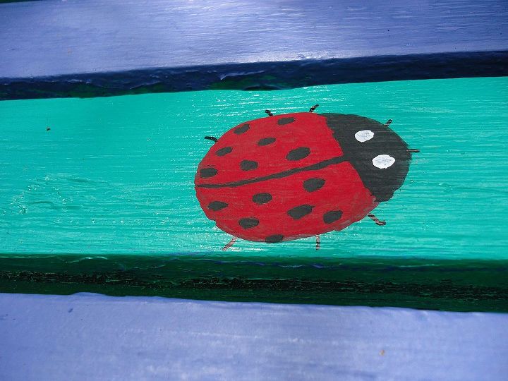 how we refurbished an old picnic table, outdoor furniture, outdoor living, painted furniture, repurposing upcycling, One ladybug almost done
