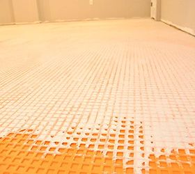 installing schluter ditra tile underlayment, flooring, tile flooring, tiling, The dovetail cut back cavities are filled with additional mortar and tile is laid overtop