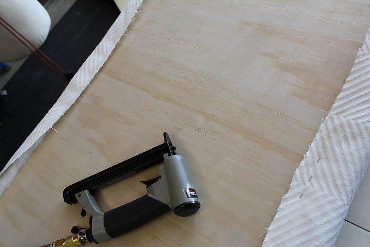 how to make an upholstered daybed, bedroom ideas, diy, how to, painted furniture, reupholster, Using power tools like like air stapler make the job much easier Also when stapling fabric or batting always remember to staple the centers of your 4 sides first