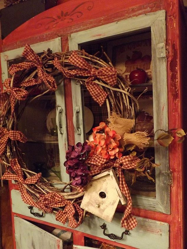 crafted wreath arrangement from thriftstore finds flower pics, crafts, home decor, wreaths, Bows hydrangeas and a birdhouse decorate this grape vine wreath