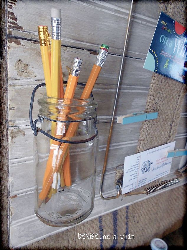 a wall organizer that s full of junky goodies, home decor, organizing, repurposing upcycling, A thrift store jar hangs on the organizer for holding pencils