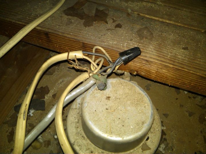 is your house cold drafty expensive to heat, heating cooling, home maintenance repairs, Attic air sealing project Notice can light splices outside of the fixture With paper backing on insulation that was covering and surrounding light This was a fire waiting to happen in this home