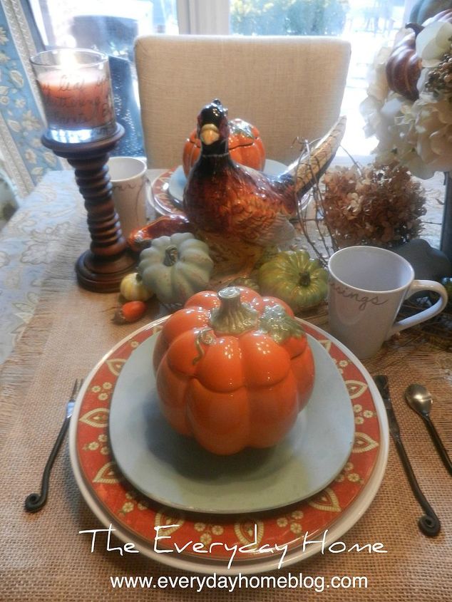 decorating a blue breakfast room for fall, seasonal holiday decor, Layered plates white paisley rust blue bowls and an orange pumpkin tureen