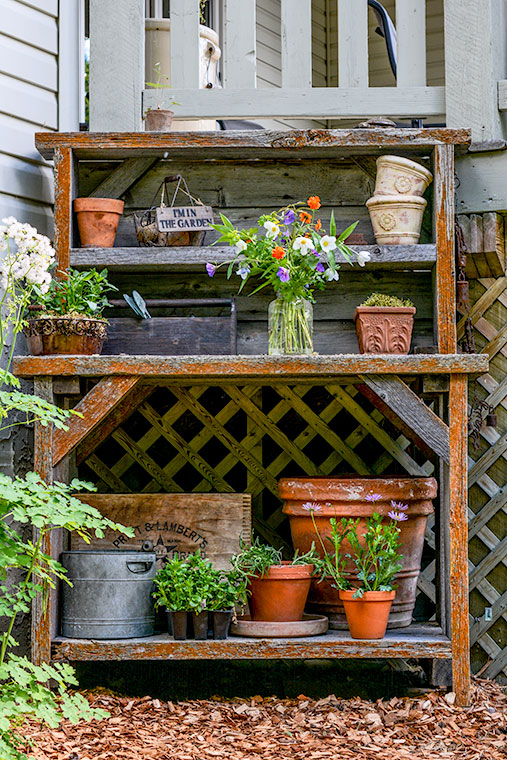 barnwood potting bench, gardening, outdoor living, This is a custom made barnwood potting bench The only thing I would change would be to have the fellow put a back on the bottom part not just the top hutch part The lattice is not part of the bench