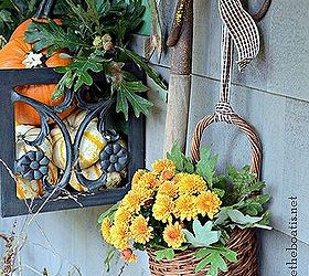 fall around the potting shed, flowers, gardening, a rake is serving as a vintage tool rack and to hang a basket of mums