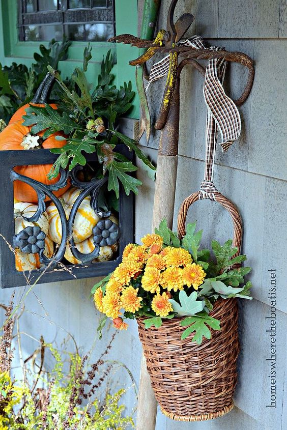fall around the potting shed, flowers, gardening, a rake is serving as a vintage tool rack and to hang a basket of mums