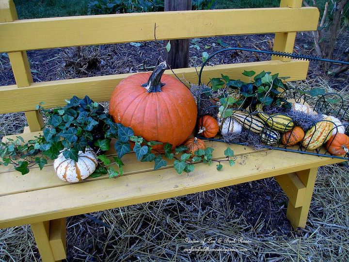diy tucking the garden in for winter at our fairfield home garden, flowers, gardening, seasonal holiday d cor, Tidy up the garden A blanket of hay on the front flower bed and some pretty gourds on a bench say Fall