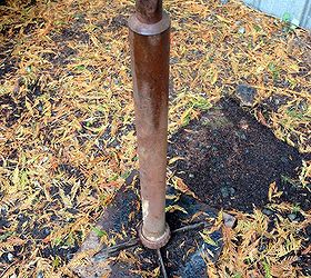 a repurposed oil funnel gear junk lamp only a tetanus shot could love, home decor, lighting, repurposing upcycling, I found this rusty metal stand at a salvaged junk yard It was perfect for the base to be