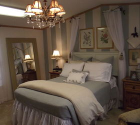downsizing texas winter home, bedroom ideas, home decor, The floor length mirror was actually a bathroom mirror that someone removed I framed it and wired a curtain tie back thru the holes that were used to hang the mirror I love it it reflects light and makes the room look much larger