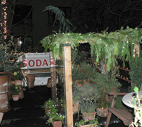 urban garden winterizing update, container gardening, diy, flowers, gardening, perennial, seasonal holiday decor, urban living, Cold Frame CLOSED NIGHT Year Two Draped in Garland Image featured in I ve never seen a billboard lovely as a tree
