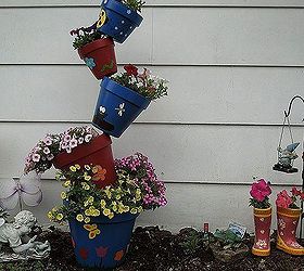 my garden and a friends tipsy pots, flowers, gardening, outdoor living, this is my tipsy pot creation it was so much fun painting and creating it