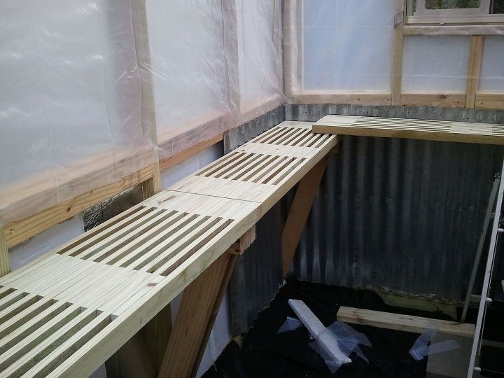 greenhouse built for less than 700, diy, gardening, outdoor living, Inside we used styrofoam panels for insulation in the lower walls and more leftover metal panels to finsh walls That s leftover wood that my husband cut up and made into shelving that could drain water