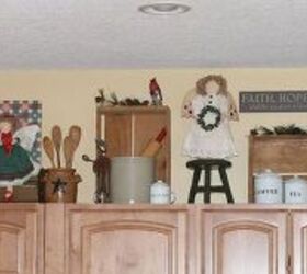 a country christmas, christmas decorations, seasonal holiday decor, I use the tops of my cabinets in the kitchen to decorate for the seasons We love to cook It s fun to collect and display cooking implements that have been used throughout the years These elements remain in all my seasonal displays