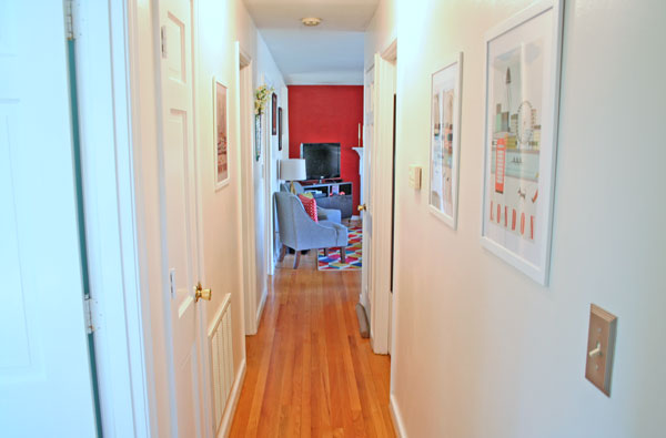 ikea travel prints in the hallway and a lesson in just starting, foyer, home decor, wall decor, Look at how bright and cheery this hallway is now I love the bright color peeking from the living room