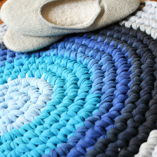 crochet t shirt rug, crafts, flooring, home decor, Cut the t shirts to create yarn and crochet it in the round to create a circle tying each new color on as you go