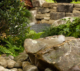photos of our garden at the southeastern flower show, flowers, gardening, outdoor living, The bubbling rock feature It is a real fieldstone boulder that had the perfect shape We drilled the rock to create this feature