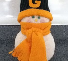 sock snow people, crafts, seasonal holiday decor, This one I made for my mother in law who is Packer fan His hat is made from the band of my husbands old thermal sock and the band from an old shirt A little hot glue is all it took Actually anything is all cut from an old shirt