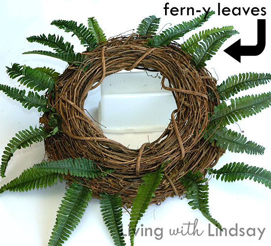 diy interchangeable wreath, christmas decorations, crafts, seasonal holiday decor, wreaths, Cut apart a fern bush watch for sales at the craft store and push them around the outside of the larger wreath You don t need to wire them or glue them just push the stems between the grapevines