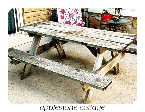 decrepit old picnic table gets a brand new look, diy, painted furniture, woodworking projects, The before splintered warped and basically ready for the fire pit