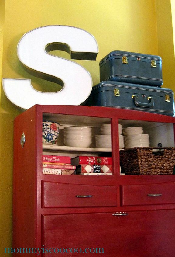 how i used an old bakers cabinet to get my family organized, kitchen cabinets, organizing, Vintage letter S with old suitcases on a baker s cabinet
