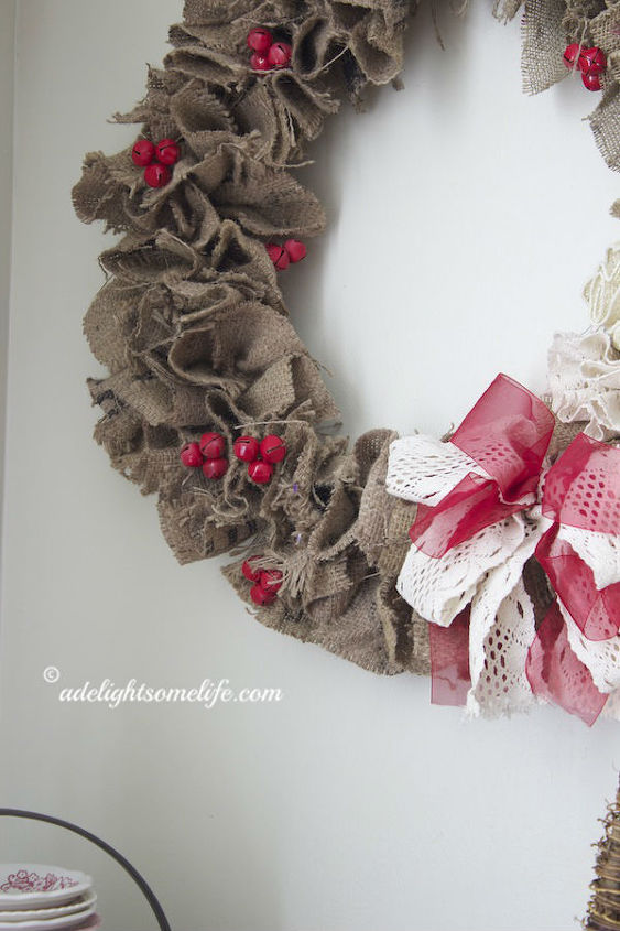 how to make a burlap christmas wreath from coffee sacks, christmas decorations, crafts, seasonal holiday decor, wreaths, jingle bells spray painted red grouped together with floral wire add just enough color to the rustic wreath
