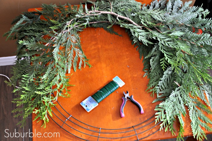 diy rustic cedar bough wreath, christmas decorations, crafts, seasonal holiday decor, wreaths, Attach the bows using floral wire