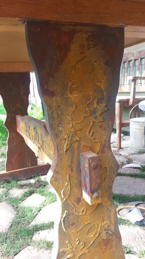 poor old table, painted furniture, I used a glue gun to add vines and leaves and then painted it iron and rust again I waxed these legs several times for durability