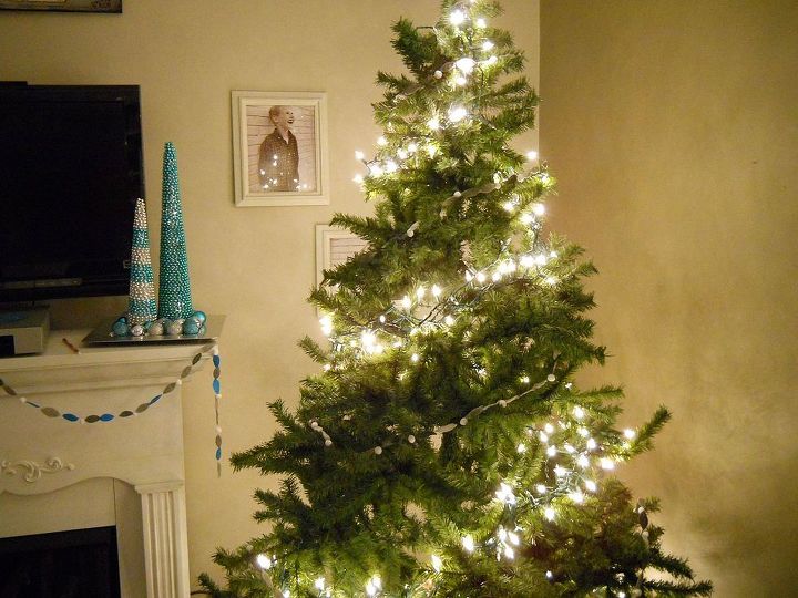 a new way to hang your christmas tree lights, christmas decorations, lighting, seasonal holiday decor, Start at the top and twist 2 3 times around the tree