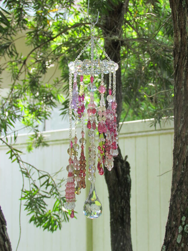 make your garden sparkle with crystals, gardening, outdoor living, Made 14 crystal tassels with Beadalon 49 count stainless steel wire hung each tassel on steel chains at varying lengths Attached each to a circle made of 18 gauge steel wire with round crystals strung between each tassel