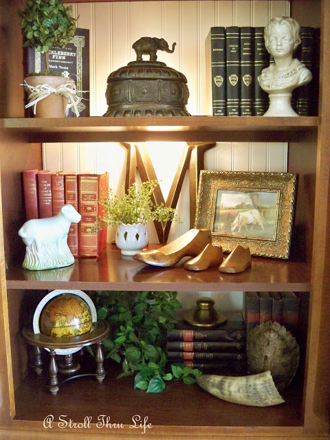 styling bookcases, decks, storage ideas, I love mixing plants and pictures in with books