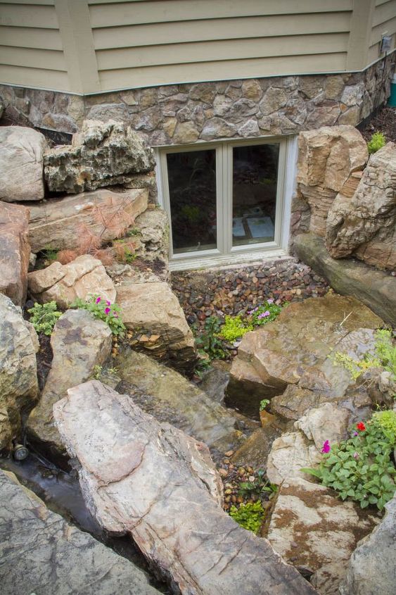 waterfalls for window wells, A mix of plants and rock was used to provide a fantastic view