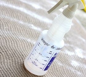 how to remove urine smell from carpet, cleaning tips, flooring, Spray the rug carpet with white vinegar and then let it sit for about 5 10 minutes while it works to eliminate the smell
