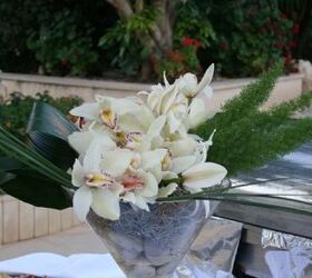 wedding flower display, flowers, gardening, outdoor living, wedding display by www flowersandstyle materials Cymbidium Orchid with greenery tillandsia moss and stones