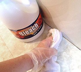 recaulk a tub in 5 easy steps plus my trick for perfect lines, bathroom ideas, home maintenance repairs, After the old caulk is swept up I like to sanitize the area to get rid of any potential mold and mildew