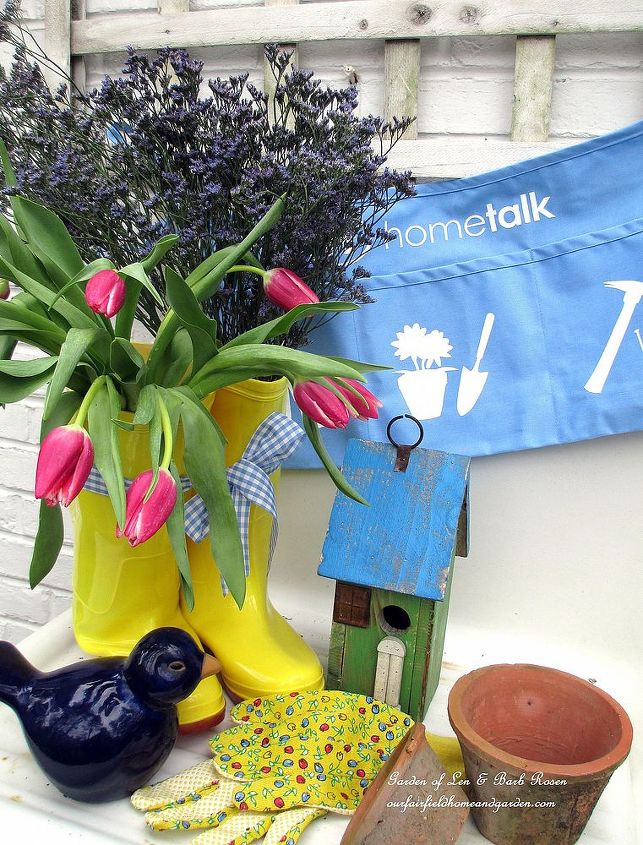 april showers bring hometalk projects and may flowers, flowers, gardening, April rain boots filled with fresh tulips and statice on the potting sink Hometalk work apron ready for action
