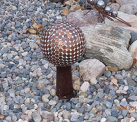 bowling ball gazing balls, gardening, this is just setting on the center hub of an old wooden wagon wheel that could not be saved