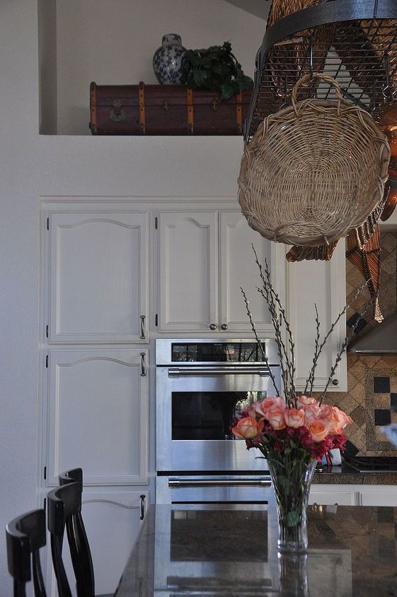 my white kitchen tour, home decor, kitchen backsplash, kitchen design, kitchen island, It s hard to see unless you visit my blog but I used lots of thrift store baskets and a red vintage trunk to add warmth and to balance all the white wood and cold tiles in here