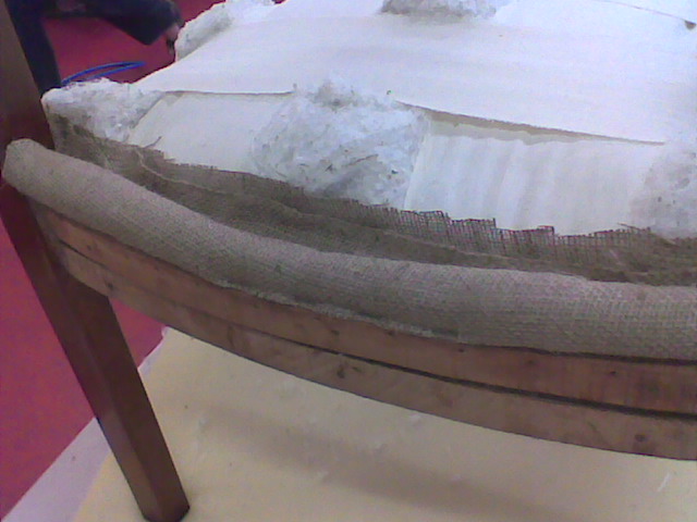 learning to upholster furniture the first lesson, painted furniture, reupholster, window treatments, Hessian covered foam made into a roll and staple to the curved front of the frame provides protection and comfort for backs of legs when sitting