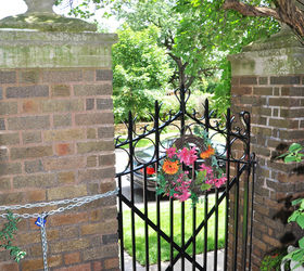 make your own garden focalpoint, flowers, gardening, Brighton up and existing gate with a colorful wreath or a sculpture looking out onto the street