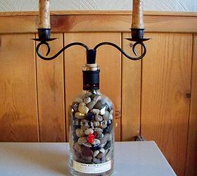 how to repupose a pendleton whiskey bottle, repurposing upcycling, filled with polished rocks black distressed metal candleholder 4 grunge candles that are battery operated